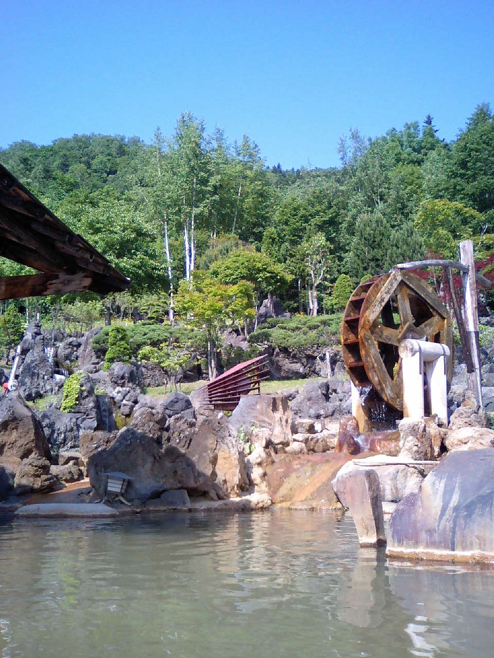 Another rotenburo shot, showing the decorative faux waterwheel and garden.