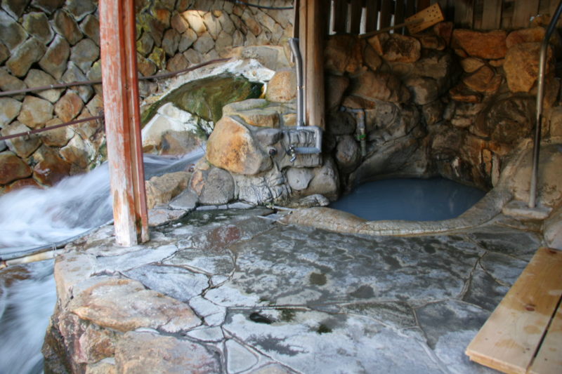 A view of the humble bathing area inside the Tsubo Yu bathhouse.
